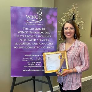 Purple Ribbon Award Winner Sarah McClarey with Award.