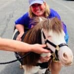 WINGS staff pose with a therapy pony