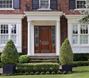 entrance of house with elegant wood grain front door