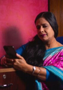 mouli-ghosh Woman holding mobile device