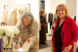 Denise Brown signs a copy of her book for the Honorable Maura Slattery-Boyle